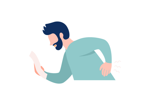 A man looking at a piece of paper as he is experiencing back pain, as if trying to figure out what the cause is.