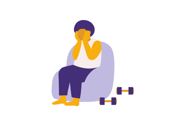 Person sitting in a light purple chair holding their head in their hands. Two weights sit on the floor next to the chair.