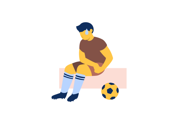 A soccer player sitting down on a pink block holding their hip. There is a sweat drop on their forehead and a soccer ball on the floor to the right.